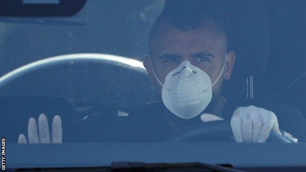 Barcelona's Arturo Vidal arrives at the club's training ground wearing a mask and gloves for a coronavirus test