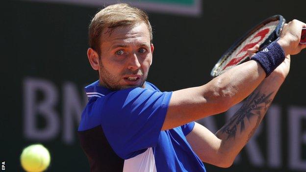 Dan Evans returns in his French Open first-round match
