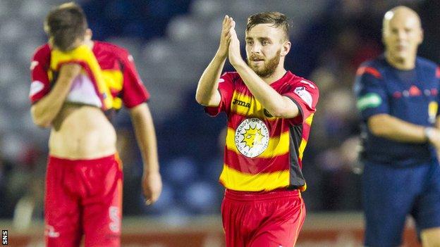 Partick Thistle's Steven Lawless applauds the fans after the game