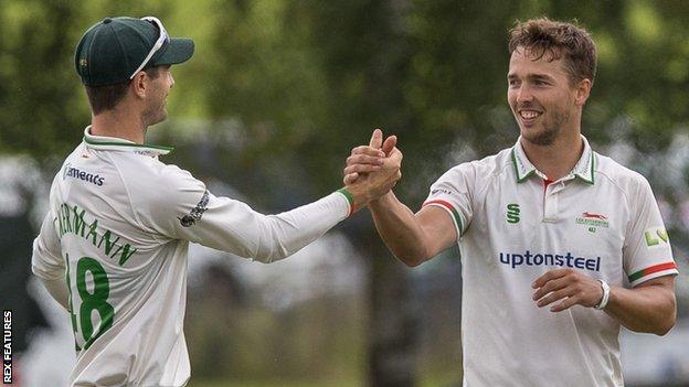 Will Davis (right) celebrates with Leicestershire captain Colin Ackermann