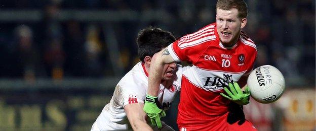 Tyrone's Mattie Donnelly manages to get the ball out of Enda Lynn's grasp in Saturday night's decider