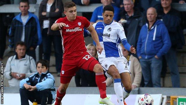 Declan John of Cardiff City tackles Daniel Leadbitter of Bristol Rovers