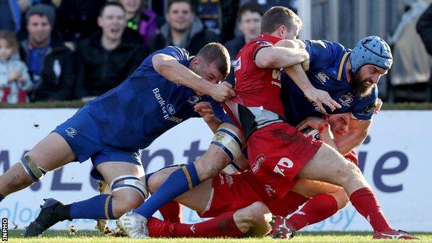 Leinster's Scott Fardy is held up just short of the Scarlets line