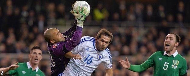Republic of Ireland's Darren Randolph beats Bosnia-Herzegovina's Senad Lulic to the ball