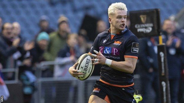 Darcy Graham scores a try for Edinburgh against Glasgow
