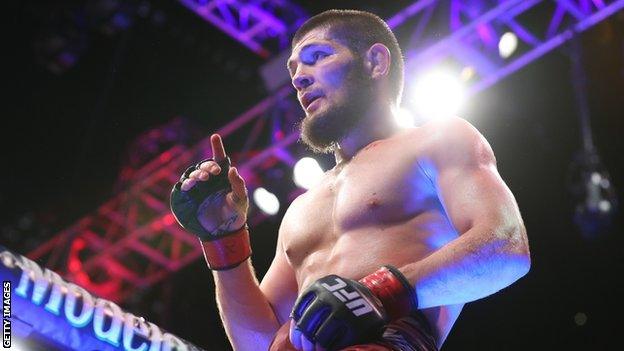 Khabib Nurmagomedov celebrates his win over Al Iaquinta to capture the lightweight belt at UFC 223