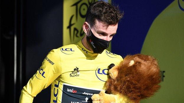 Adam Yates leaves the podium in the yellow jersey after stage five of the 2020 Tour de France