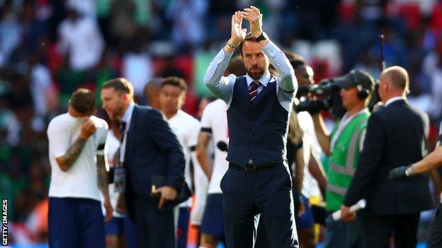 Gareth Southgate applauds the England supporters after their friendly with Nigeria