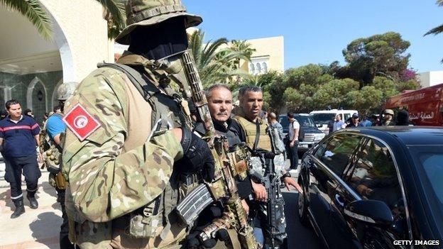 Tunisia security forces stand in front of the hotel following the attack