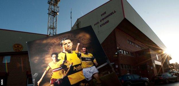 A match programme cover featuring Phil O'Donnell in front of the Phil O'Donnell stand at Motherwell's Fir Park