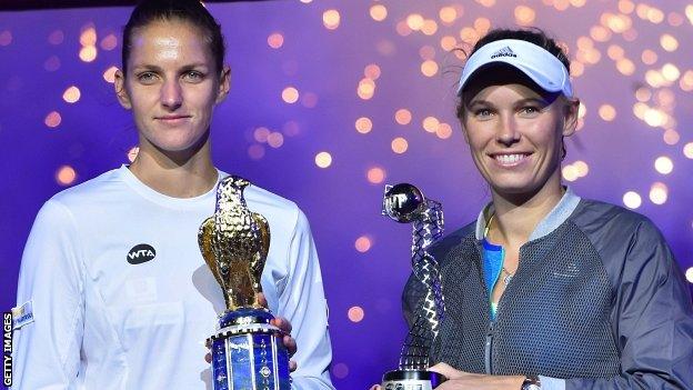 Karolina Pliskova (L) of the Czech Republic celebrates winning against Caroline Wozniacki