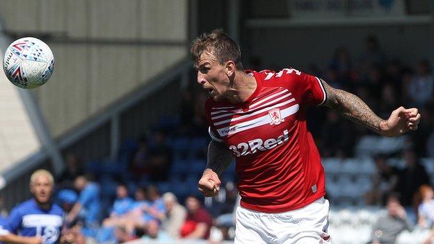 Aden Flint heads the ball in a pre-season friendly