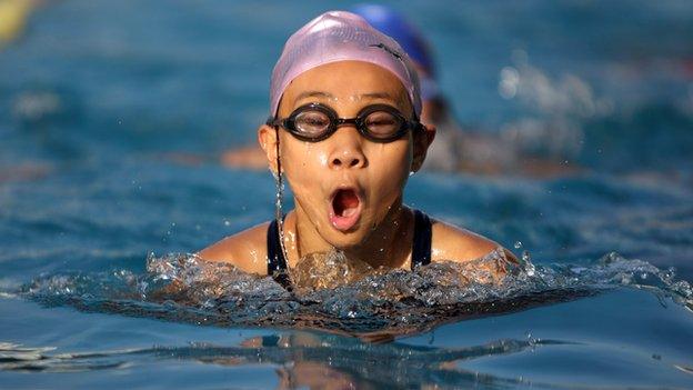 young girl swimming