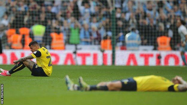 Oxford United pictures dejected at full-time in EFL Trophy final