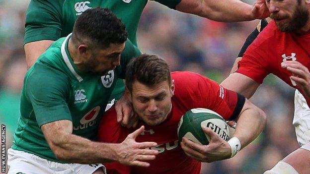 Dan Biggar takes a tackle from Ireland's Rob Kearney in the 2018 Six Nations