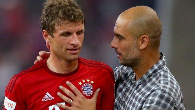 Bayern Munich striker Thomas Muller (left) and manager Pep Guardiola