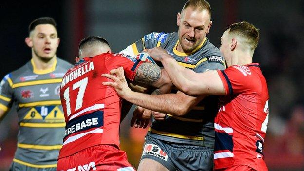 Castleford forward Liam Watts is held by Hull KR pair Elliot Minchella and Frankie Halton