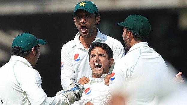 Mohammad Abbas celebrates taking the wicket of England's Joe Root