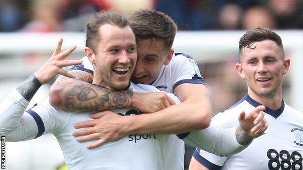 Stevie May (left) celebrates scoring for Preston