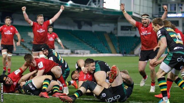 Ulster celebrate their fourth try