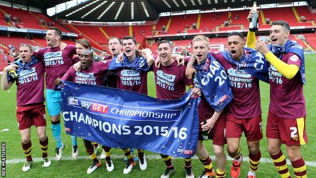 Burnley's players celebrate their Championship title