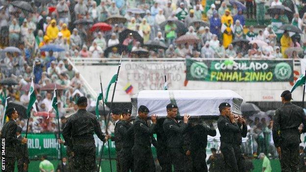 A coffin is brought into the club's stadium on the day of the moving memorial service