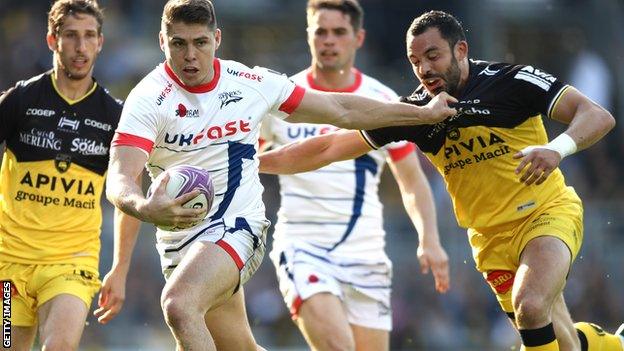 James O'Connor of Sale Sharks is held by Geoffrey Doumayrou