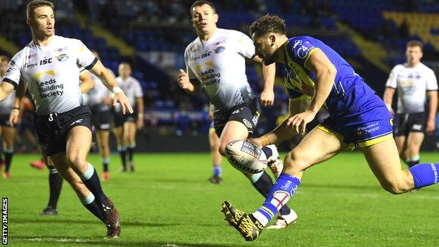 Toby King scores a try for Warrington