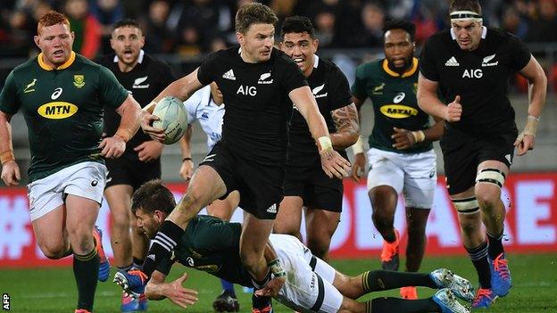 New Zealand's Beauden Barrett is tackled by South Africa's Lukhanyo Am