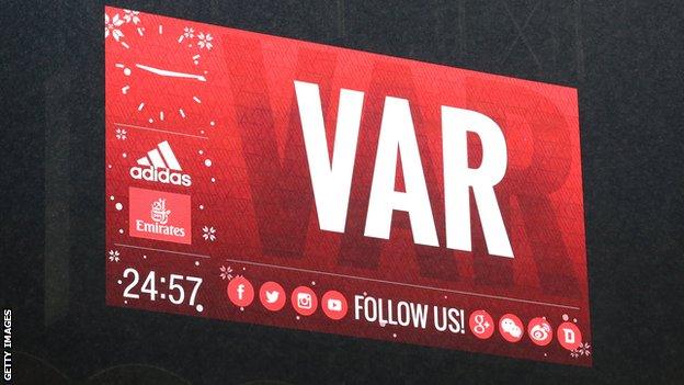 The Stadio Giuseppe Meazza scoreboard shows the use of VAR during the TIM Cup match between AC Milan and FC Internazionale