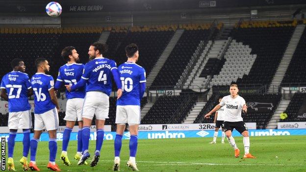 Martyn Waghorn curls the ball up and over Cardiff's wall to put Derby in front