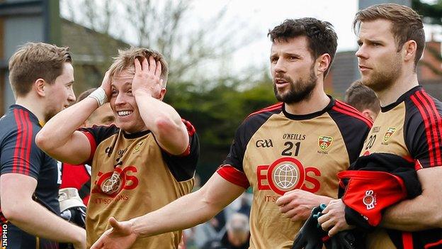 Down celebrated a draw against Cork which kept them in Division Two