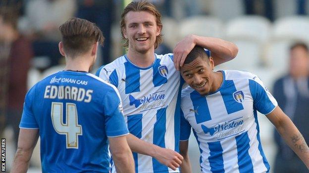 Colchester United's players celebrate