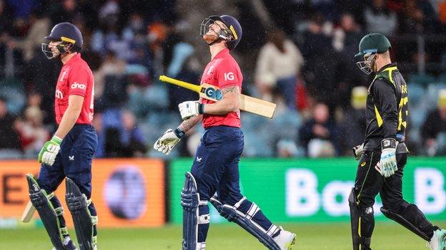 Ben Stokes looking at the sky as he walks off at the end of England's innings