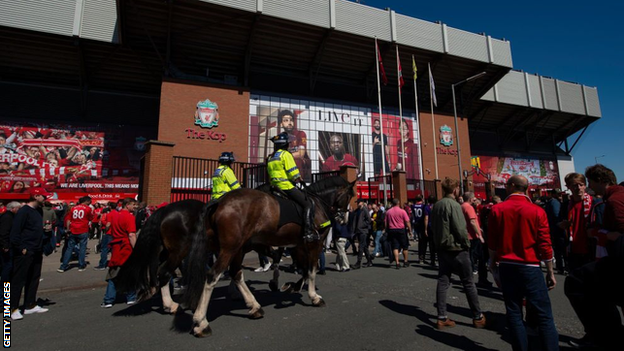 Police on horseback outside Anfield