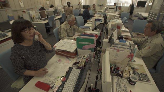 Koreisha office in Tokyo, people on phones