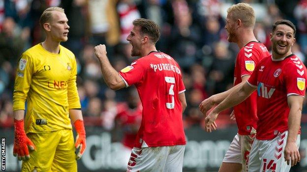 Ben Purrington (centre) celebrates scoring for Charlton Athletic against Doncaster Rovers