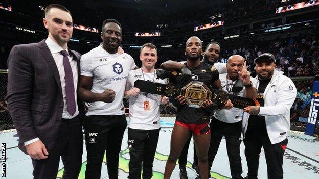 Leon Edwards celebrates with his team after beating Kamaru Usman