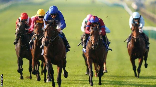 Native Trail and jockey William Buick (in blue) on their way to victory at Newmarket