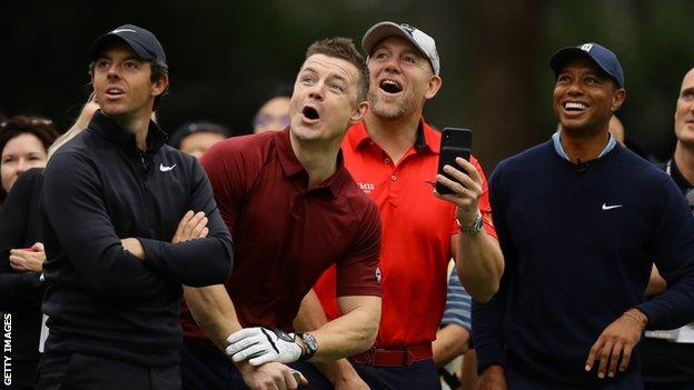 Former rugby players Mike Tindall and Brian O'Driscoll playing golf with Rory McIlroy and Tiger Woods