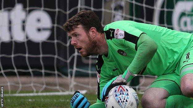 Adam Collin makes a save for Notts County in the League Two play-off semi-final second leg against Coventry City