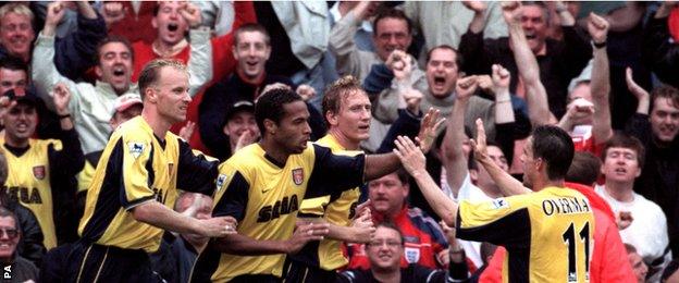 Thierry Henry celebrates his first goal for Arsenal