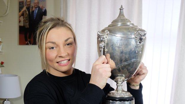 Lauren Price with the BBC Cymru Wales Sports Personality of the Year trophy