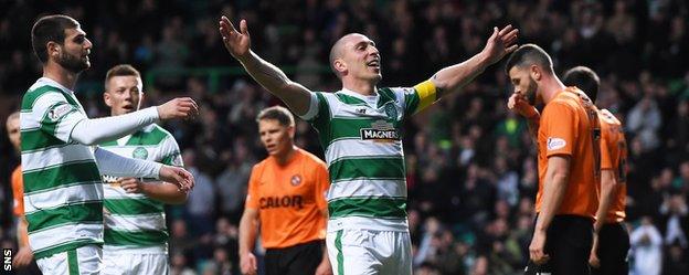 Celtic's Scott Brown celebrates scoring against Dundee United