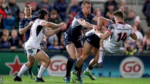 Connacht's Cian Kelleher and Matt Healy combine to tackle Angus Kernohan of Ulster