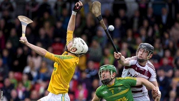 Brendan Rogers pokes in Slaughtneil's goal after Dunloy keeper Ryan Elliott fumbled a long ball