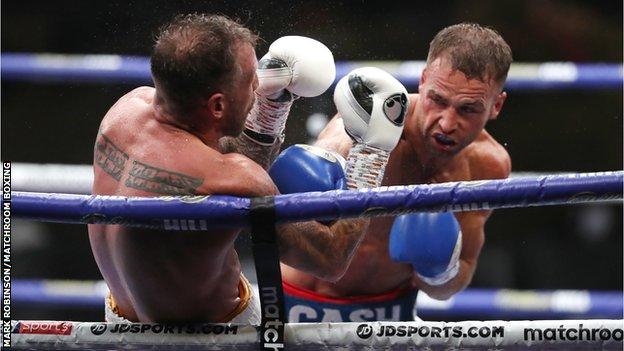 Felix Cash (right) lands a punch on Jason Welborn (left) during his Commonwealth middleweight title defence