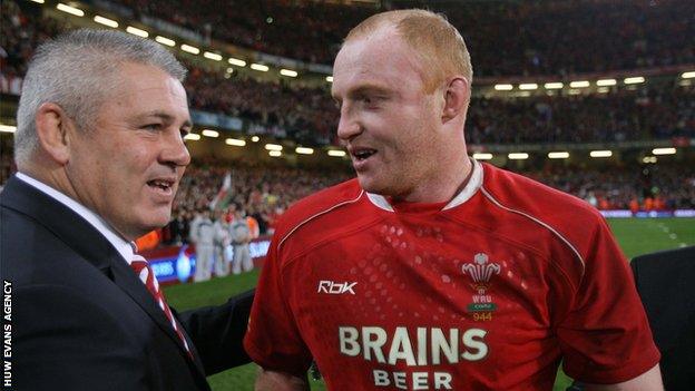 Wales coach Warren Gatland and flanker Martyn Williams share a moment after clinching the 2008 Grand Slam