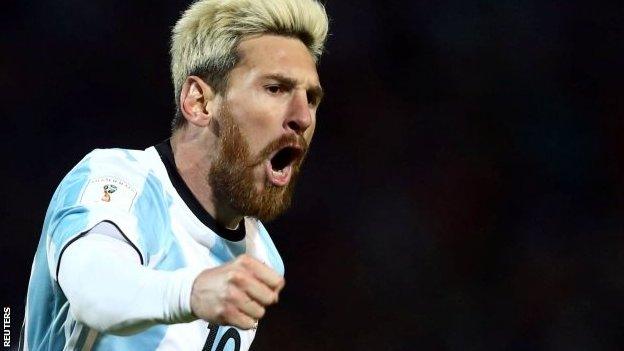 Lionel Messi celebrates scoring against Uruguay