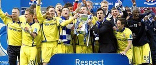 Kilmarnock players celebrate winning the Scottish Communities League Cup